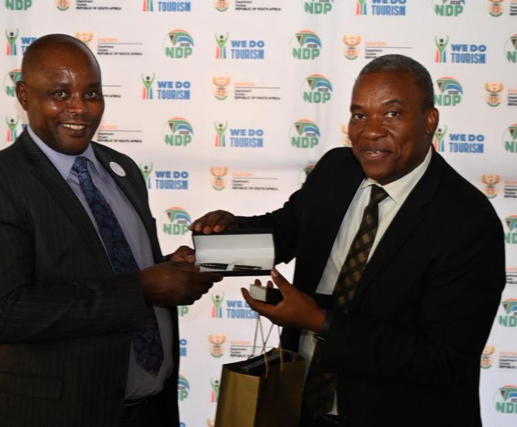 Director General of South Africa Department of Tourism Mr.Nkhumeleni Victor Vele, Director General of the South African Presenting Gift to Tourism Secretary David Gitonga Department of TourismNkhumeleni Victor Vele, Director General of the South African Department of Tourism to